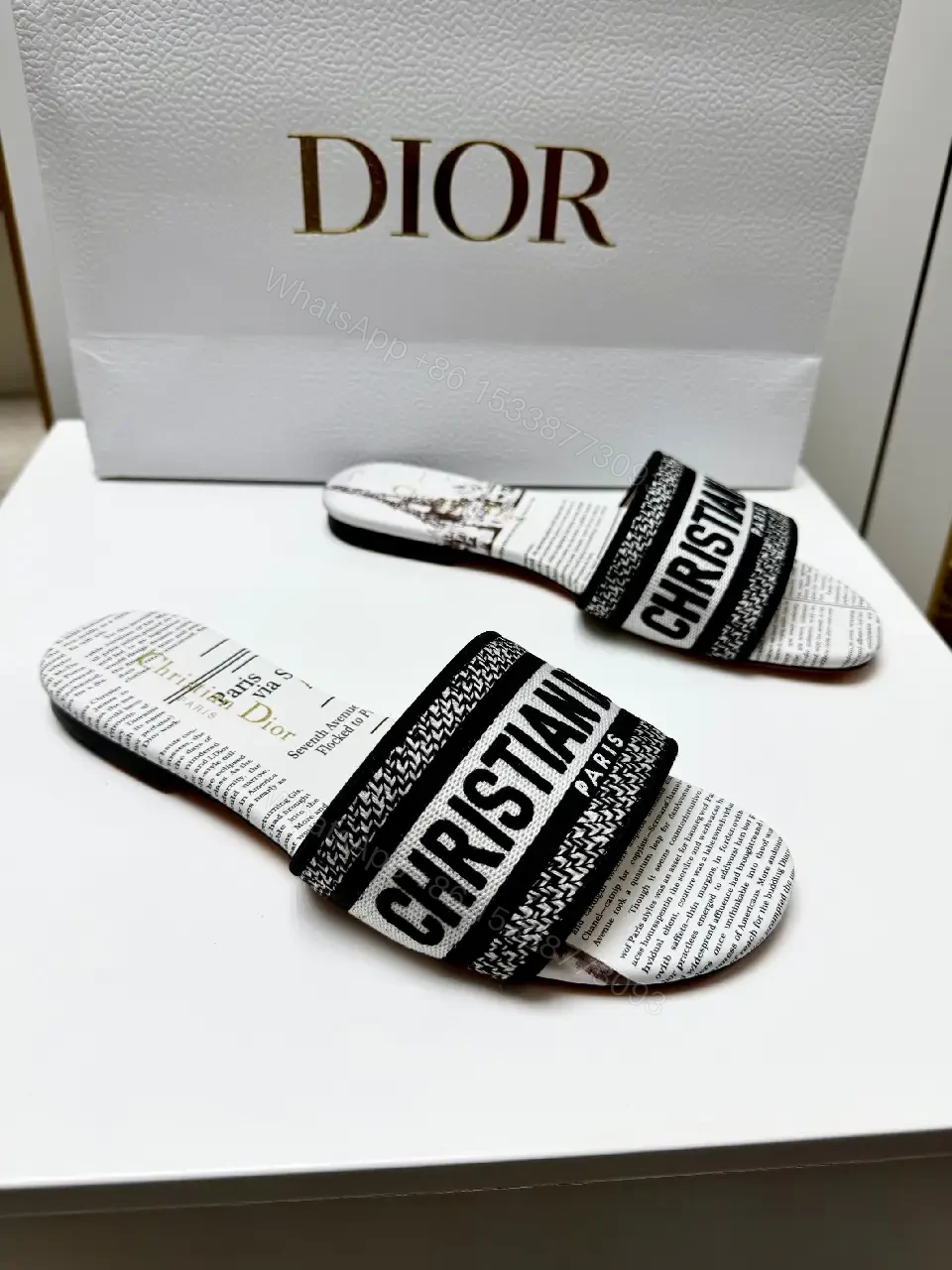 View 8 of white textile slide sandal with monogram pattern luxury logo strap for everyday luxury