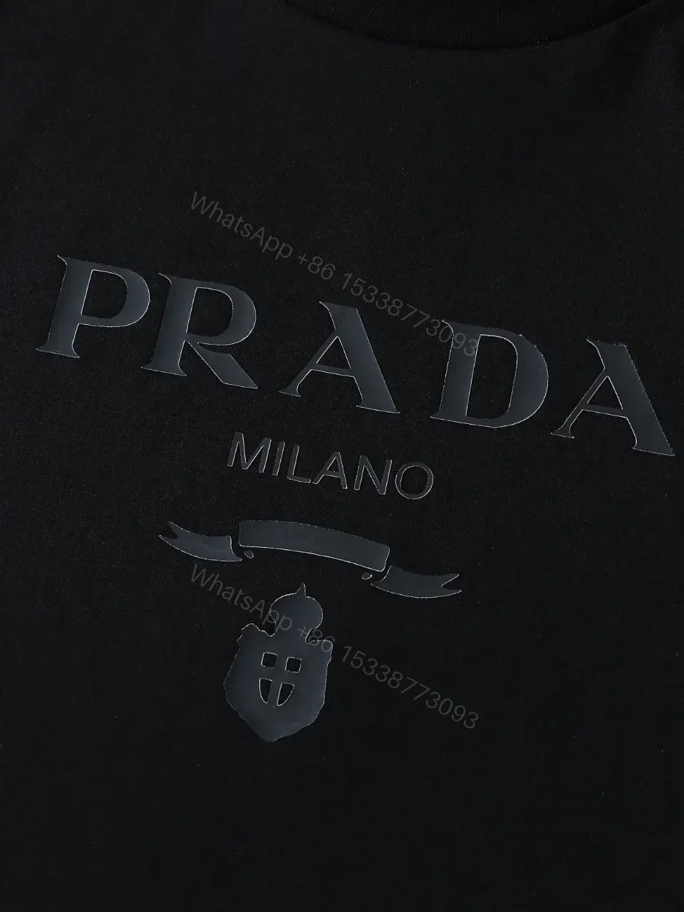 View 4 of Minimalist Black Cotton Tee: Logo-Embossed Luxury Top