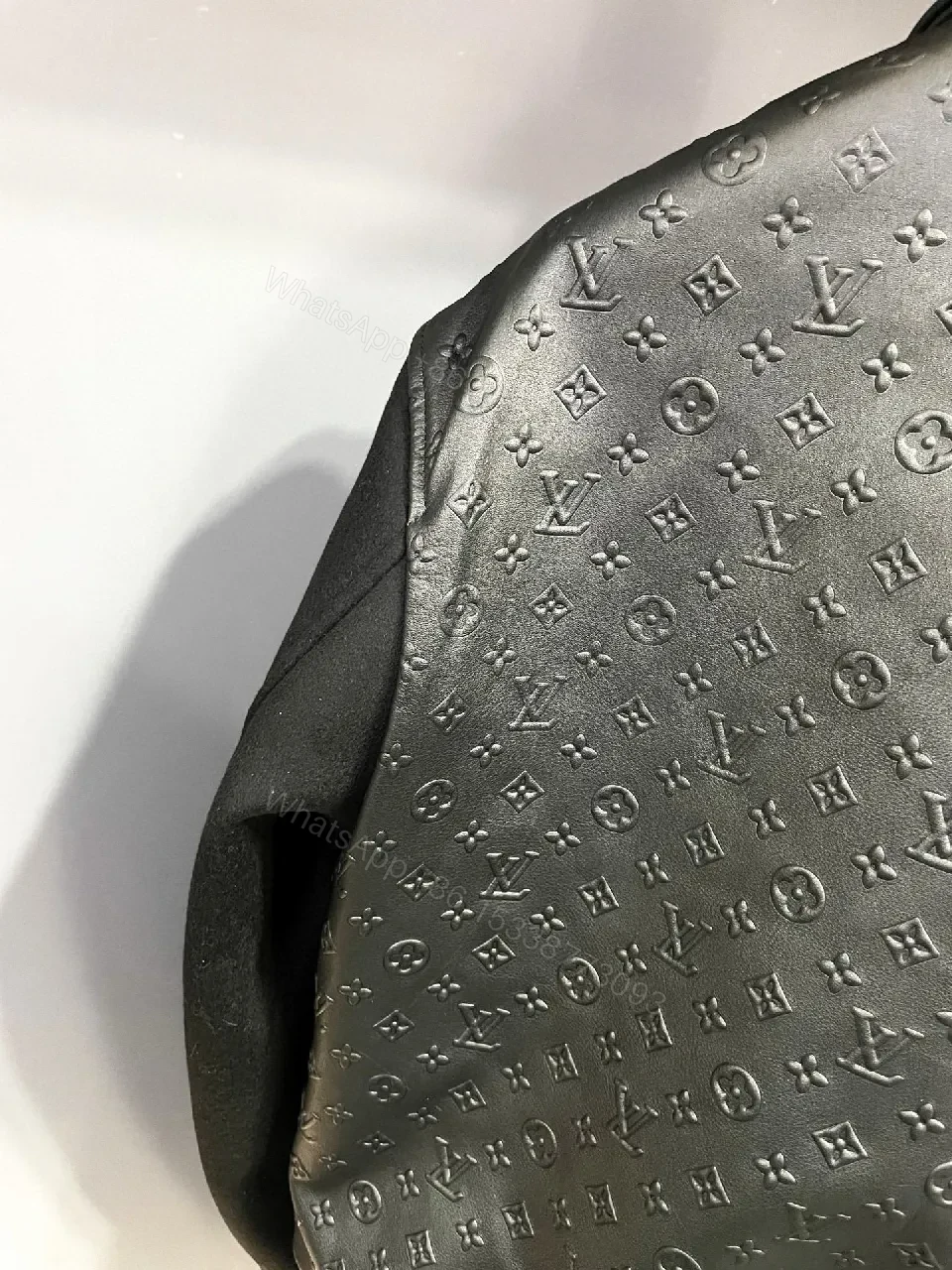 View 4 of Monochrome Leather-Embossed Varsity Jacket: Luxe Texture
