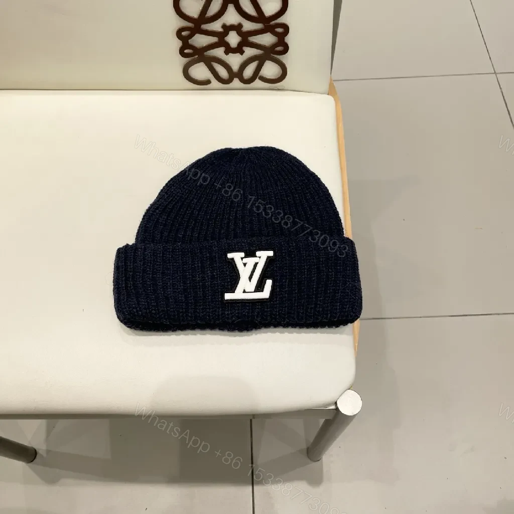 Cozy Black Knit Beanie with Subtle Emblem Detail — view 1