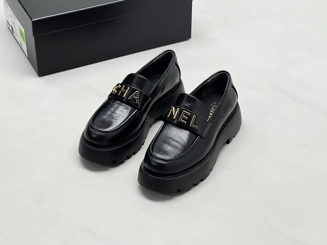 Black Leather Chunky-Soled Loafers with Gold Monogram Band — view 1