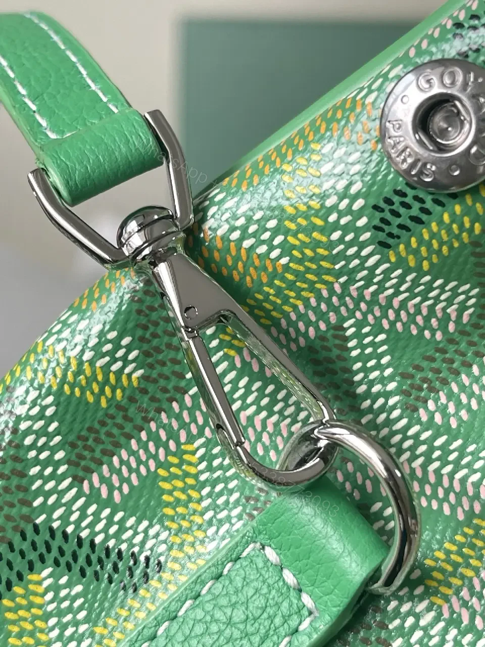 View 2 of green leather mini backpack with monogram pattern and luxury green trim for everyday use