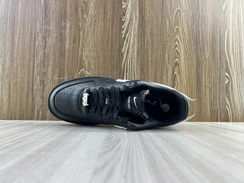 View 9 of Black Leather Low-Top Sneakers with White Swoosh - Luxury Streetwear