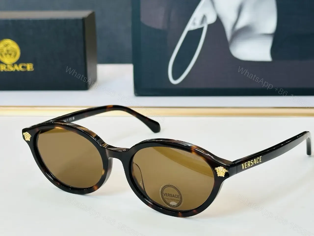 View 9 of Glassy Black Round Sunglasses with Gold Accents, UV400 Protection