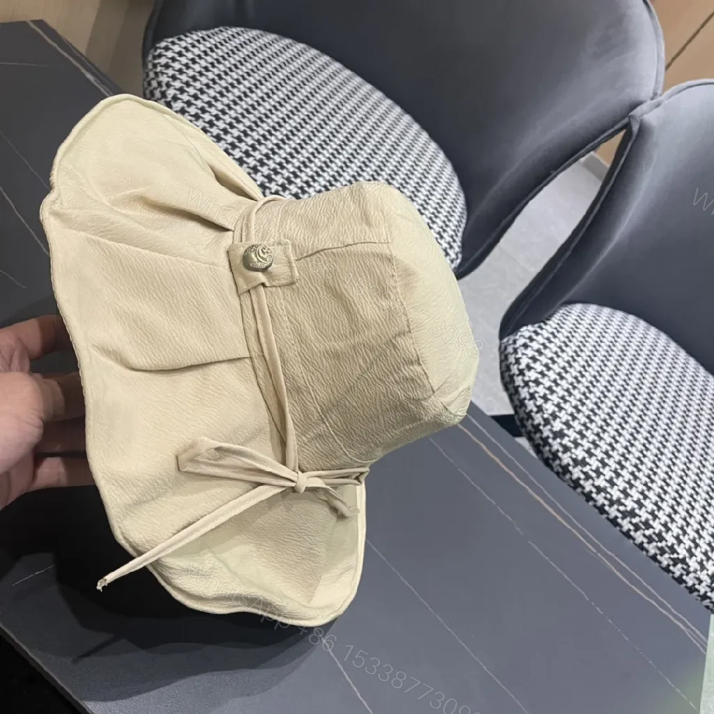 View 4 of Beige Textured Bucket Hat with Emblem, Everyday Luxury