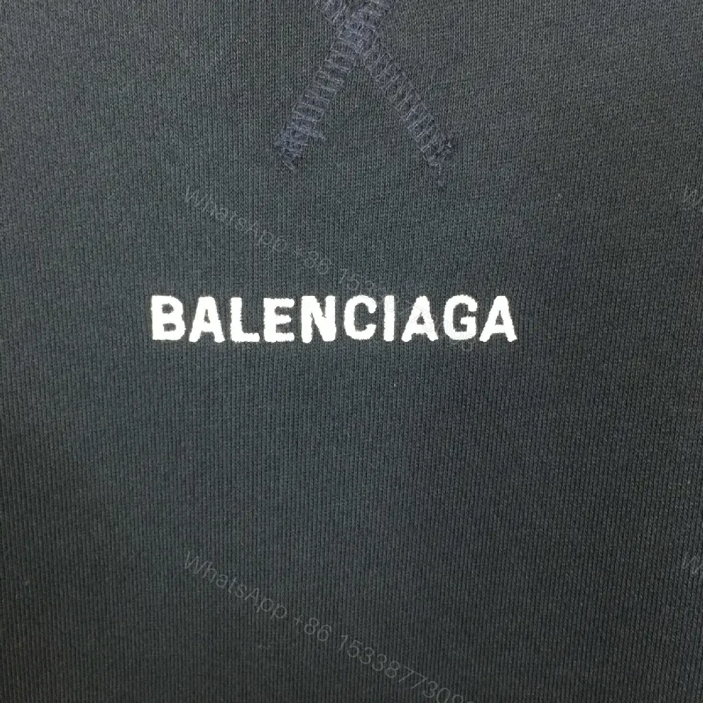 View 3 of Deep Black Hoodie: Minimalist Logo, Premium Knitwear, Relaxed Fit