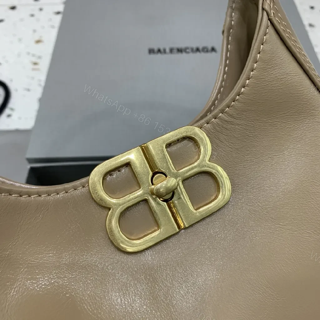 View 4 of Compact Taupe Leather Handbag with Gold Hardware, Crossbody Ready