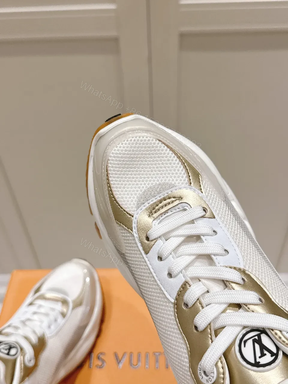 View 4 of Chunky White & Gold Luxe High-Tops: Signature LV Motif Sneakers