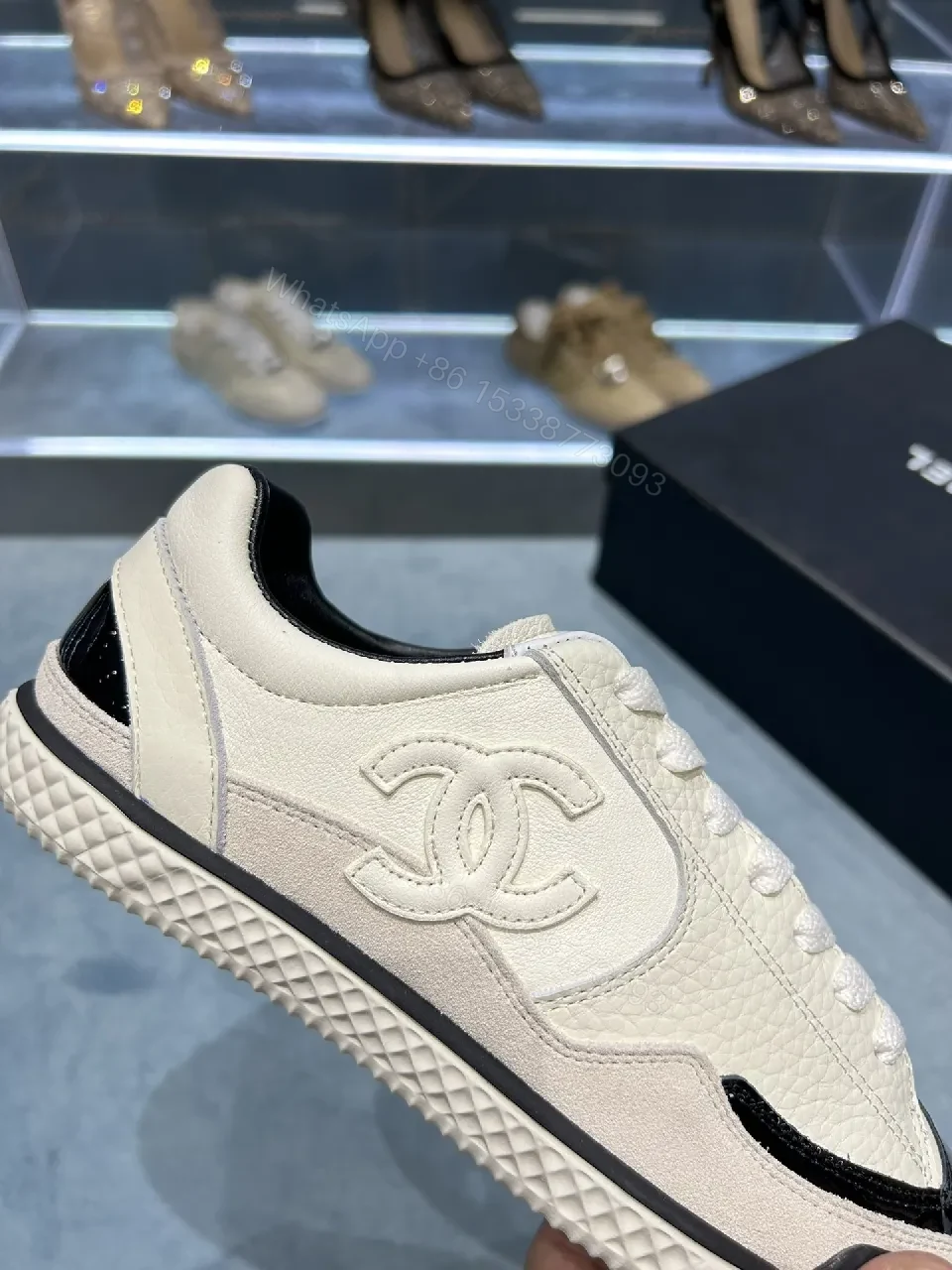 View 2 of Cream Leather Sneaker + Subtle Chanel-Inspired Detail + High-Top Comfort + Timeless Glossy Toe + Sneaker