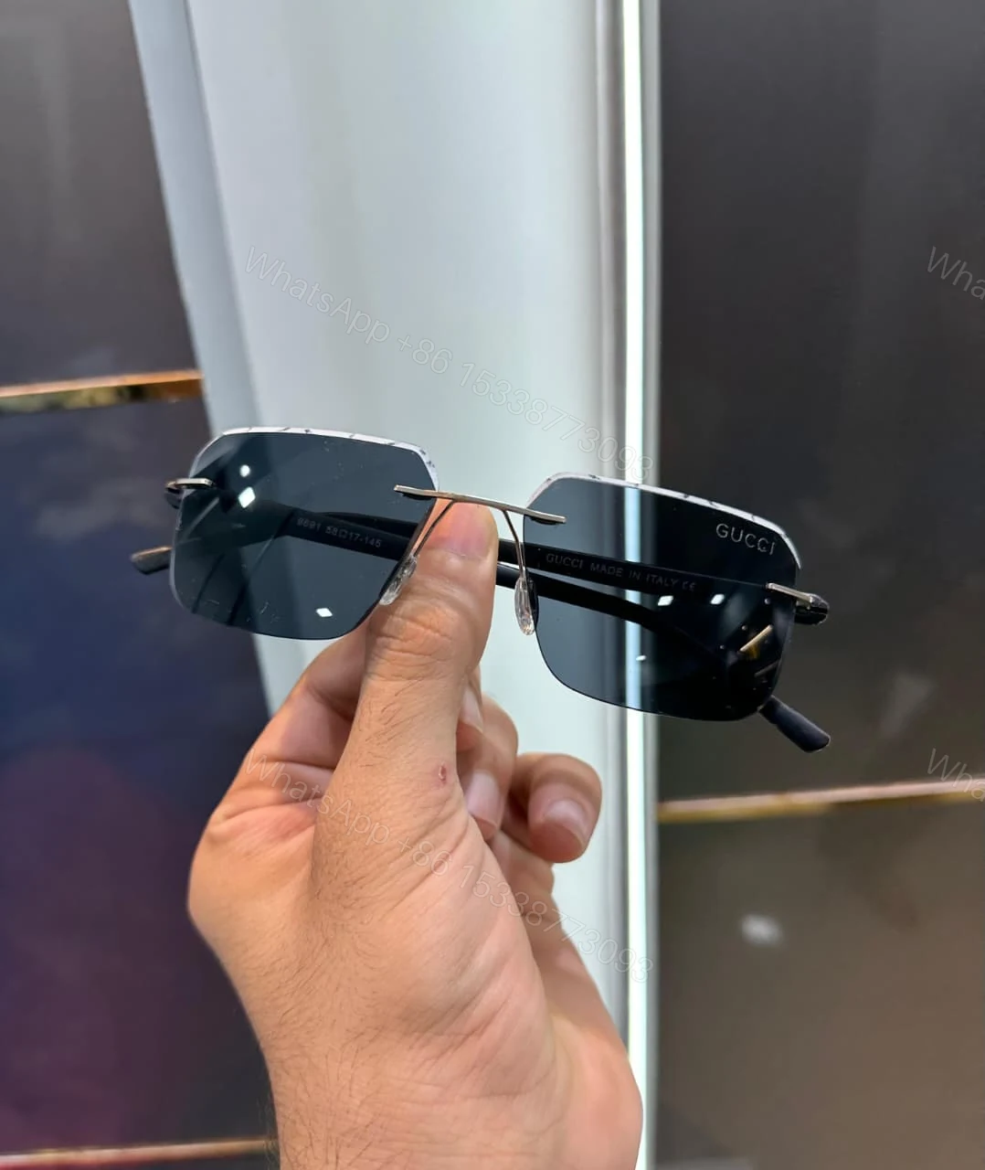 View 2 of Gucci Rectangular Rimless Sunglasses Black-Silver