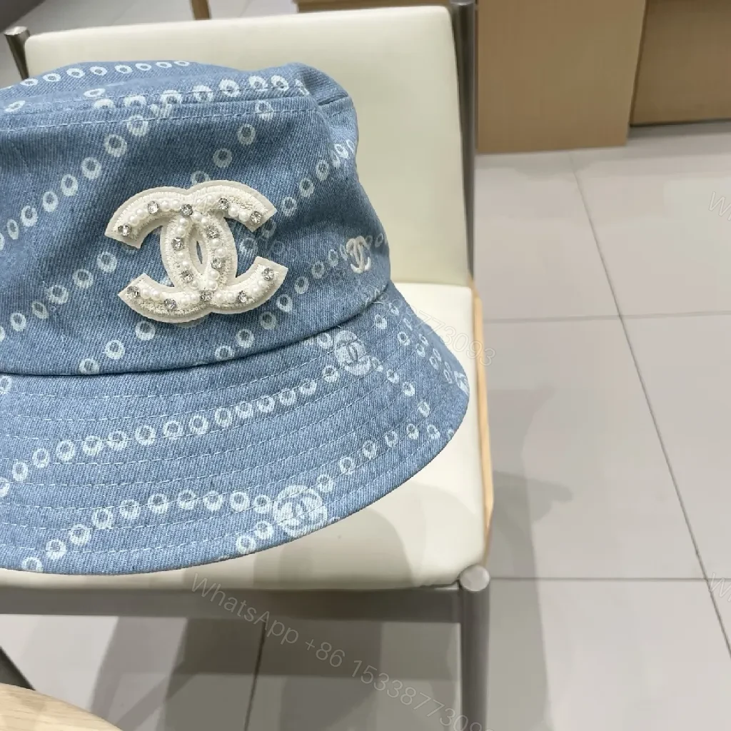 View 4 of Denim-Threaded Bucket Hat with Emblem: Bold, All-Season Style