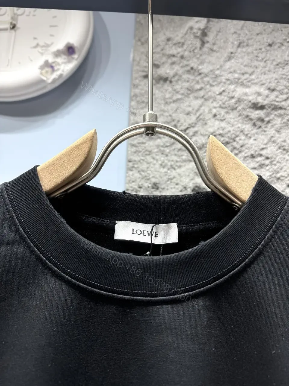View 3 of Black Cotton Tee with Subtle Embroidered Graphic, Minimal Luxury, Everyday Wear