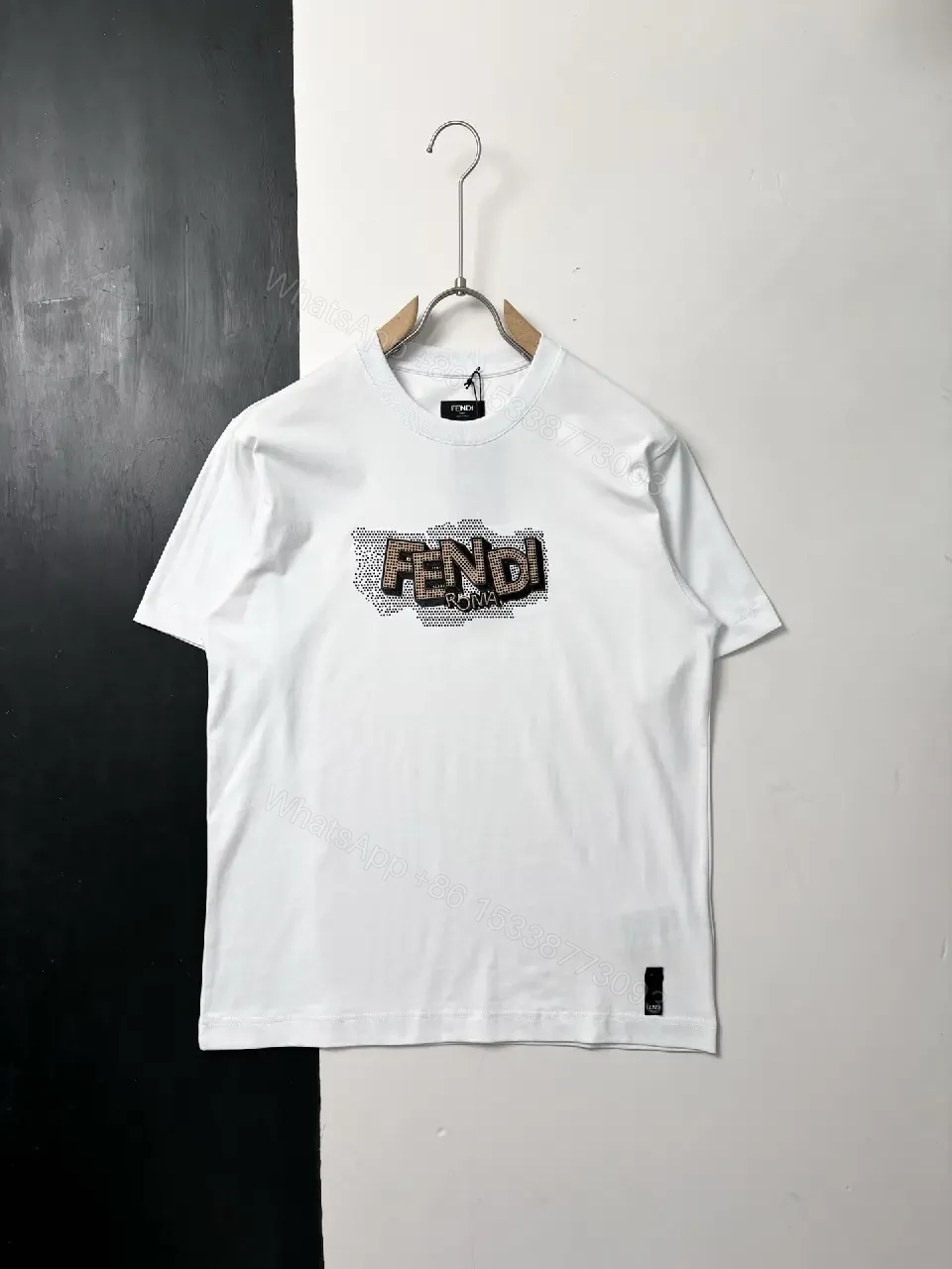View 9 of Black Knit Tee with Bold Contrast Logo, Minimalist, Everyday Comfort