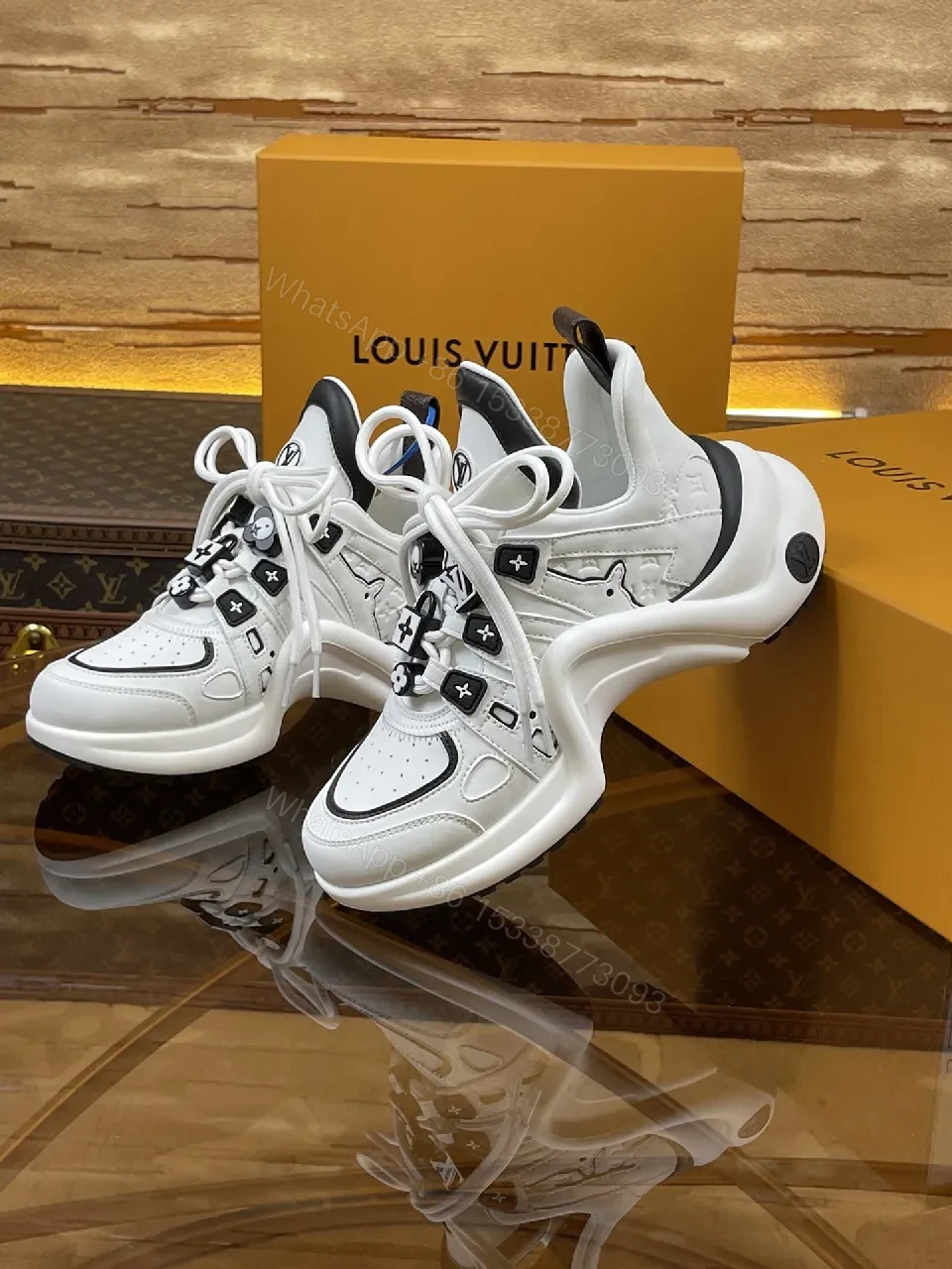 View 3 of Premium Leather High-Top Sneakers with LV Embellishments