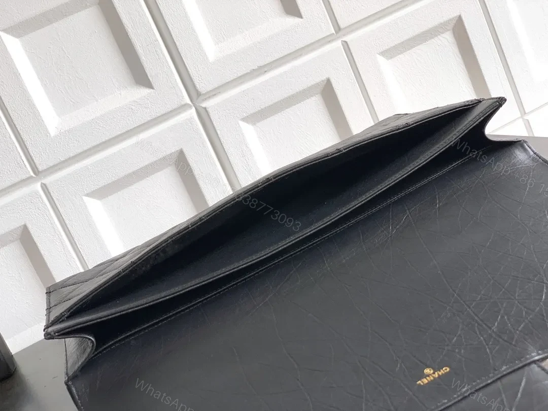 View 9 of Quilted Black Clutch with Gold-Accent Hardware Luxury Compact