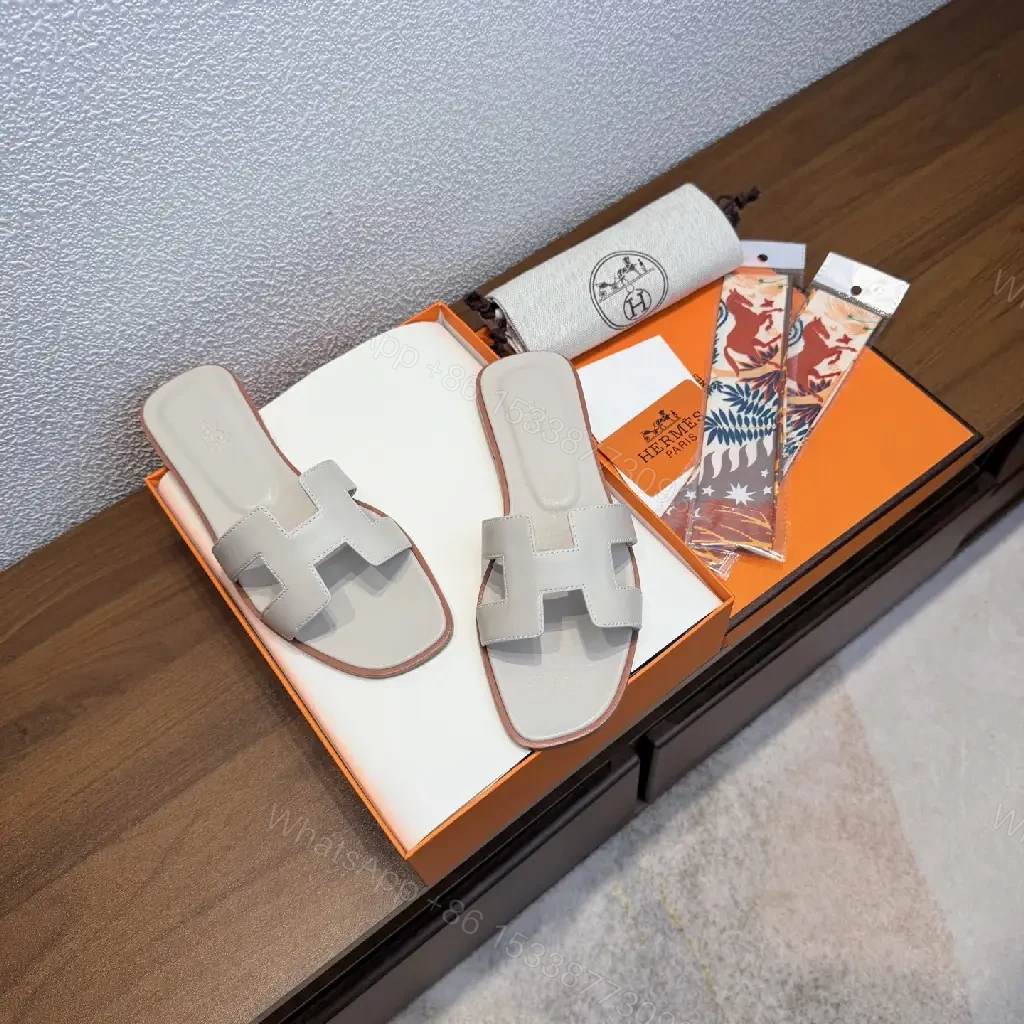 View 3 of White Leather Hermès Sandals with Cross Straps Slide Sandals Preview Set