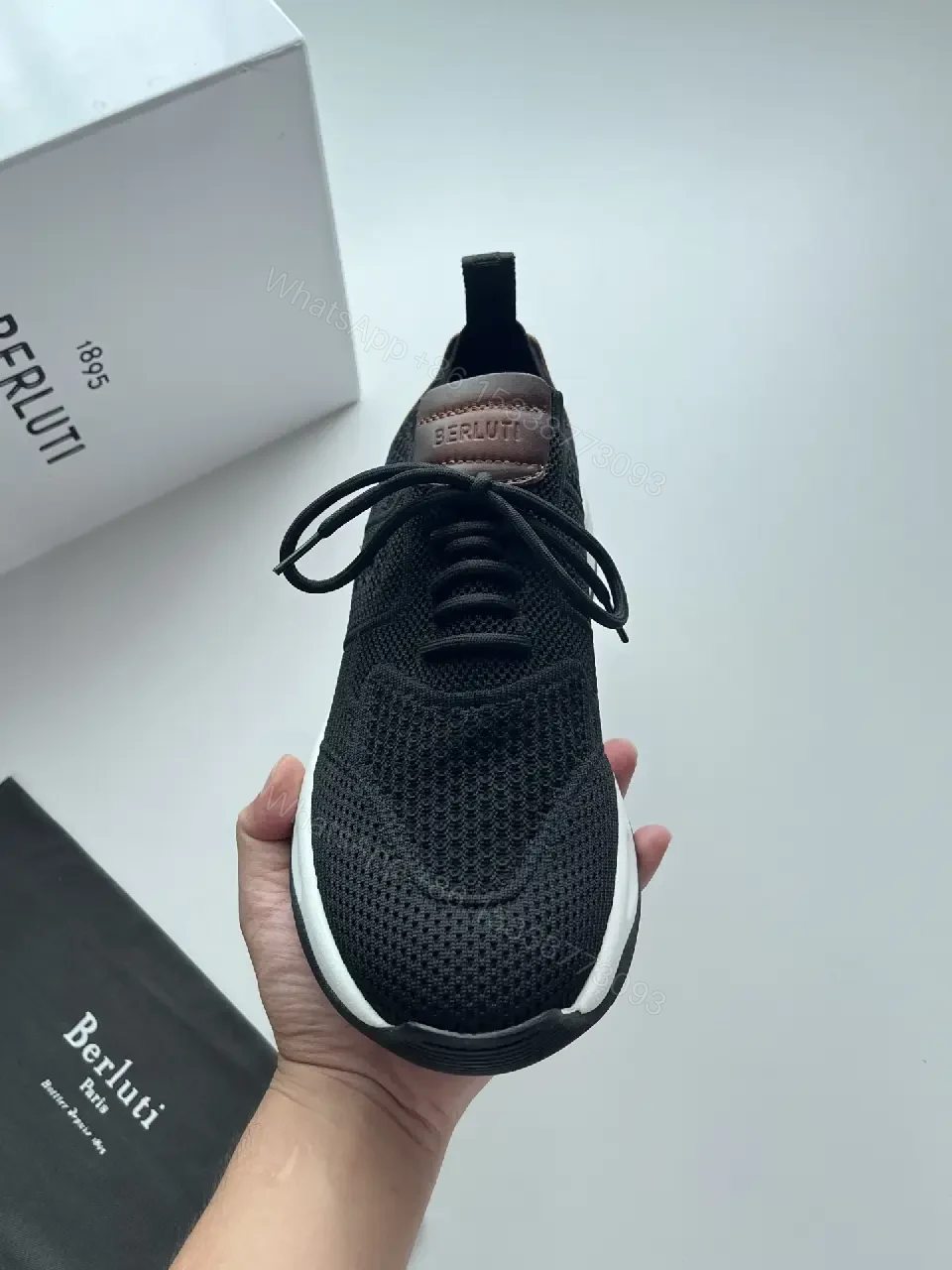 View 2 of Black knit sneakers with leather trim for everyday luxury and comfort