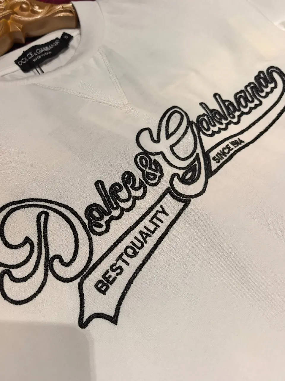 View 2 of Minimalist White Cotton Tee with Subtle Front Logo and Patches