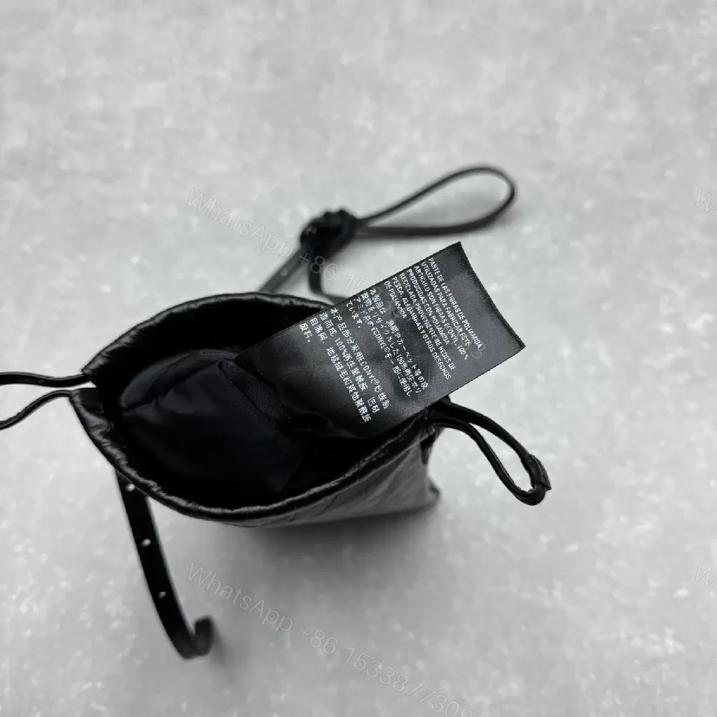 View 12 of Black Leather Drawstring Crossbody Bag - Minimalist Luxe Compact Carry