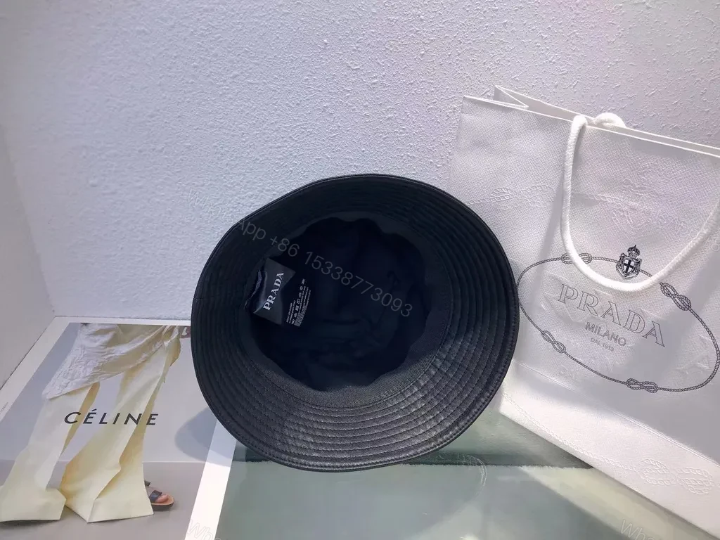 View 6 of Black Leather-Texture Bucket Hat with Prada-Inspired Logo