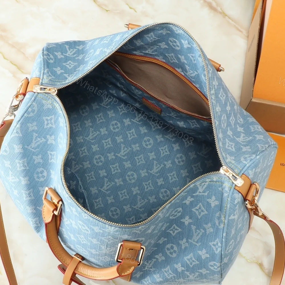 View 6 of Louis Vuitton Keepall Bandoulièrè 45 Bag Sky Blue Denim 45Cm M25334
