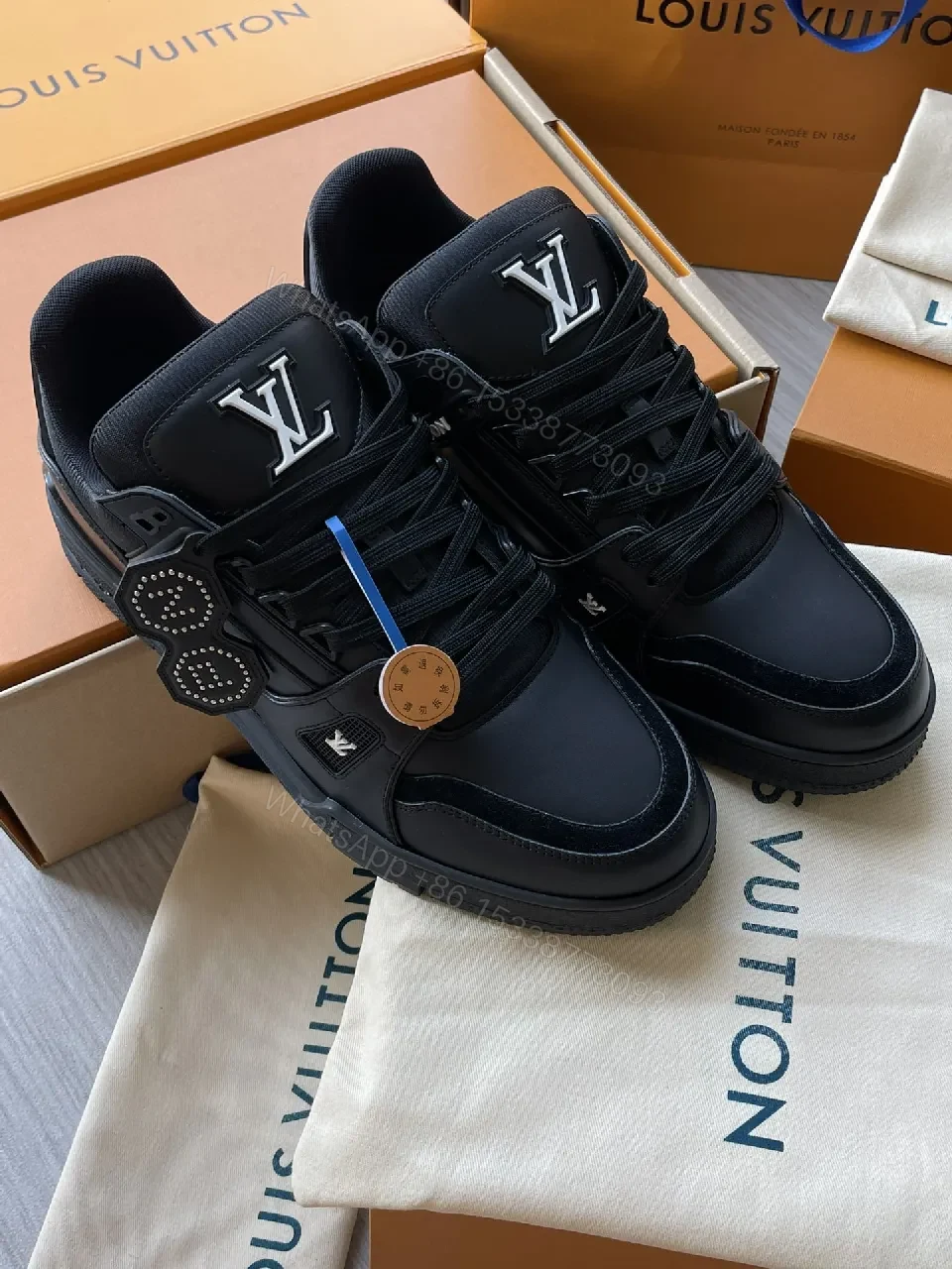 View 6 of Black Leather High‐Top Sneakers with LV Embellishments