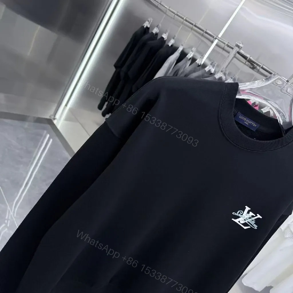 View 4 of Minimalist Black Crewneck with Subtle LV-Accent - Luxury Staple