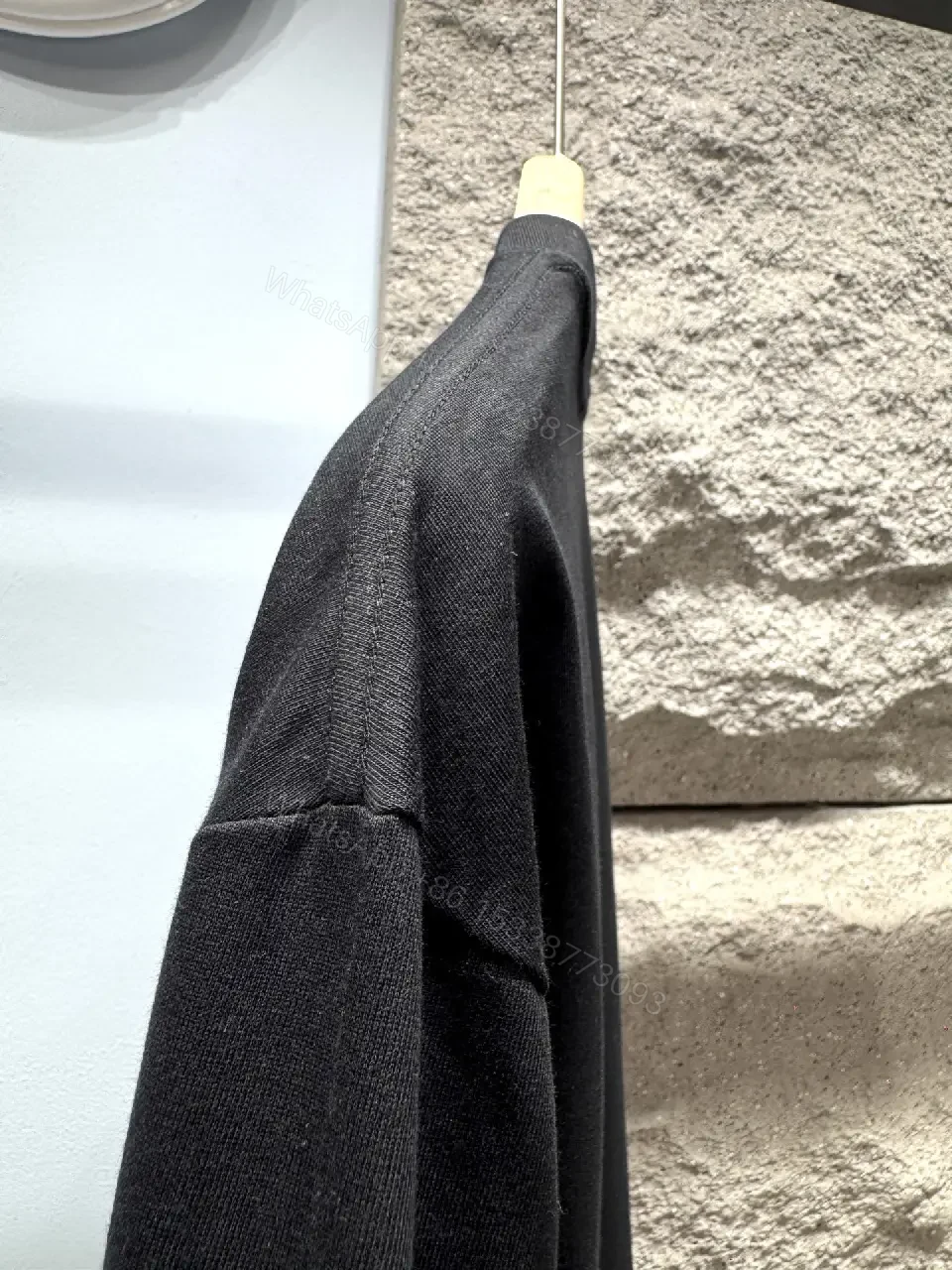 View 8 of Minimalist Black Tee with Subtle Logo – Everyday Luxe Tee