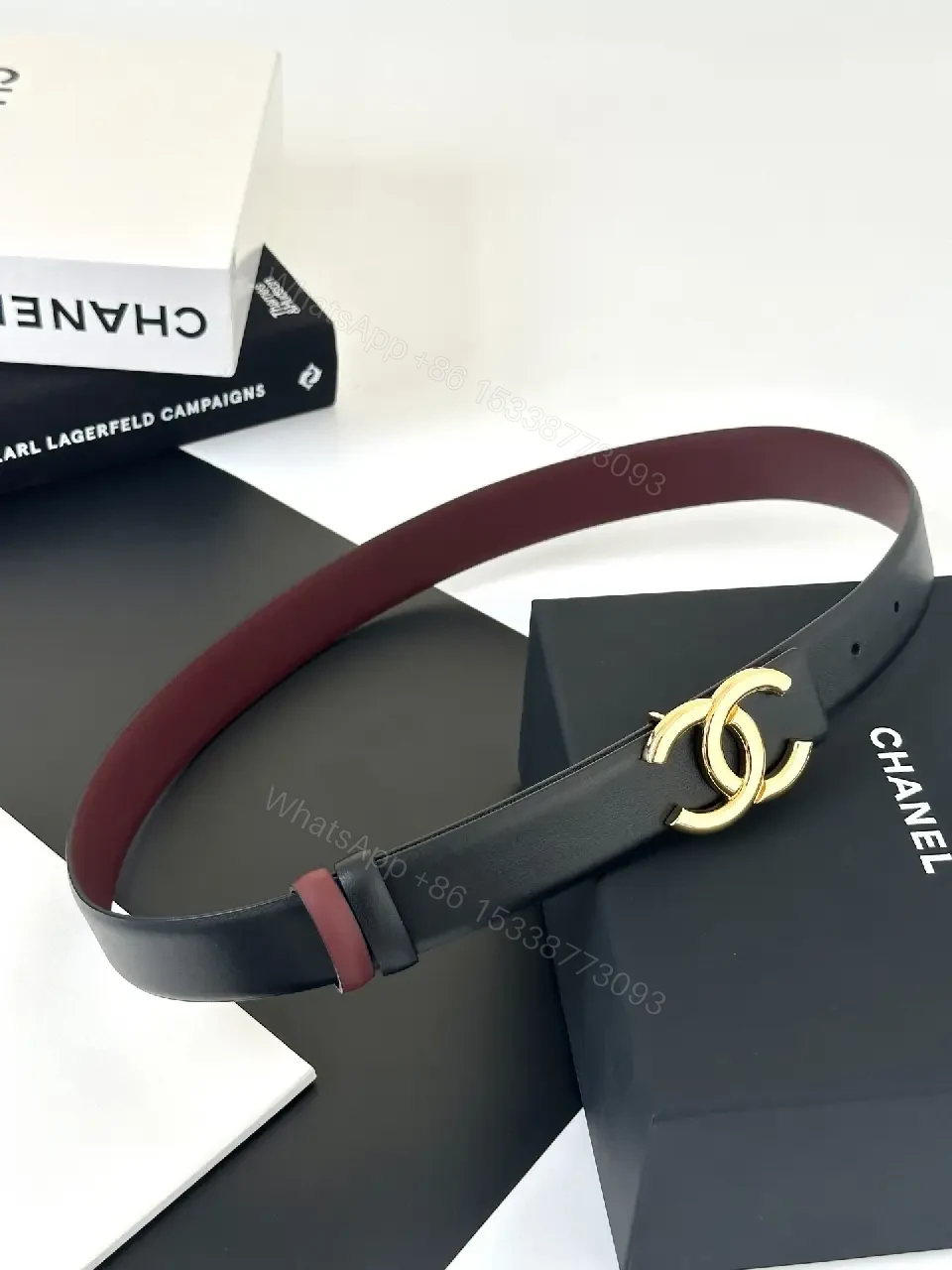 View 3 of Two-Tone Black/Burgundy Leather Belt with Gold Logo Buckle