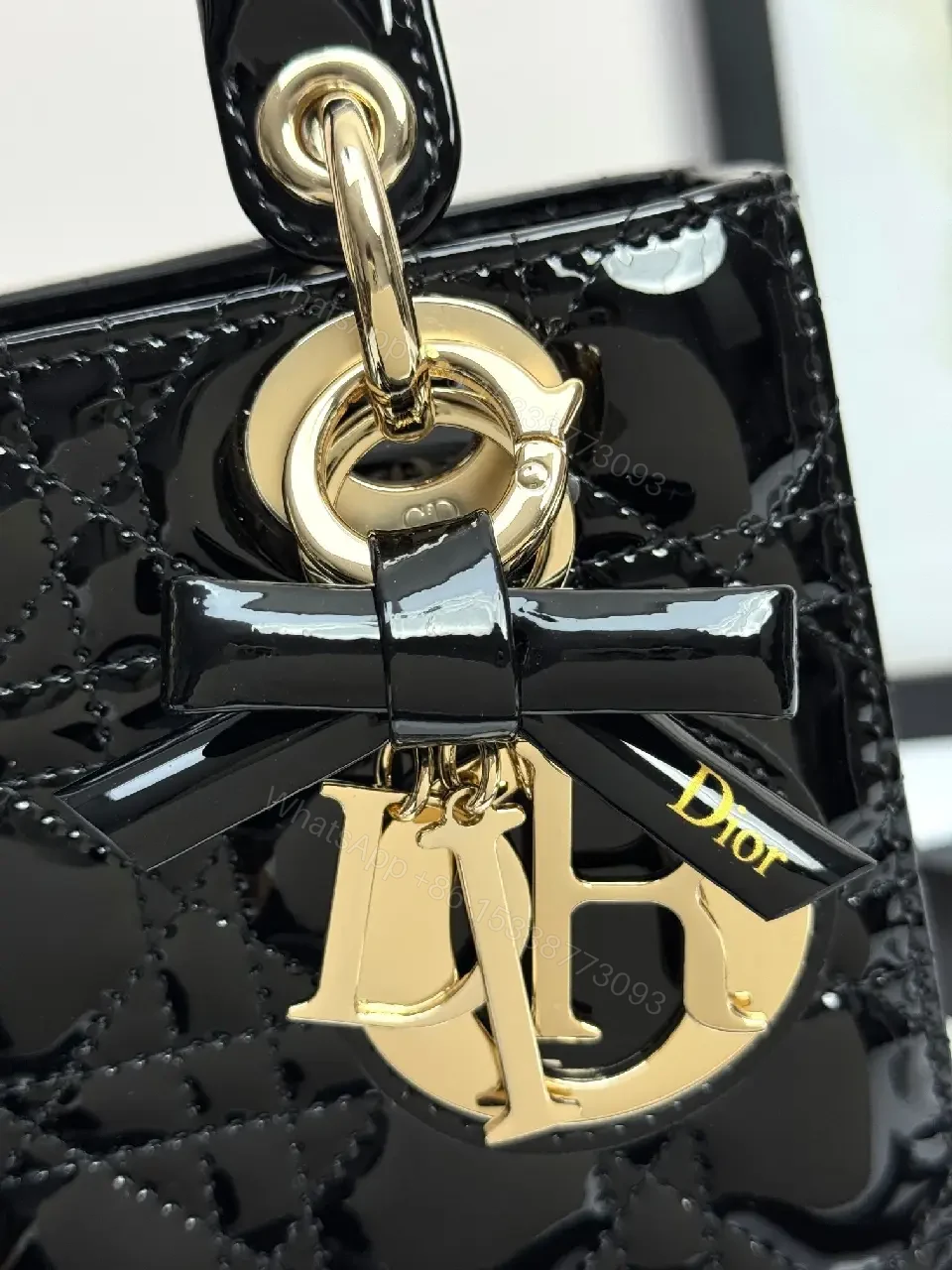 View 4 of Quilted Patent Mini Bag with Gold-Tone Charms, Black