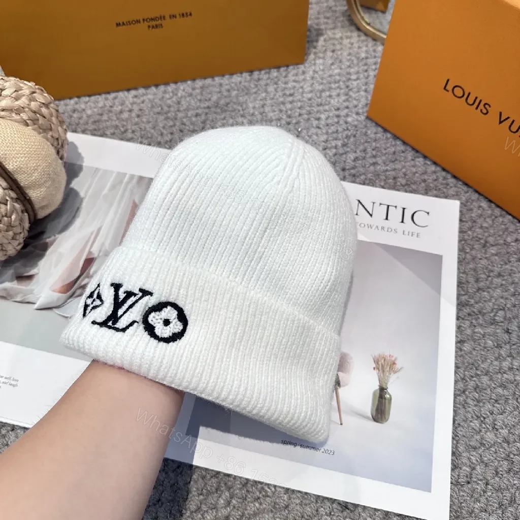 View 5 of White Knit Beanie – Luxe Logo Detail, All-Season Comfort