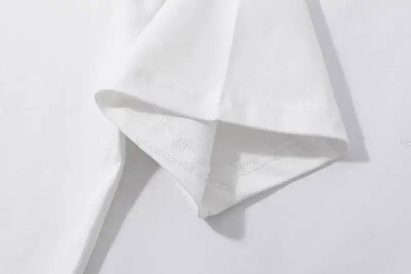 View 5 of Minimalist White Tee: Premium Cotton, Subtle Logo, Everyday Luxury
