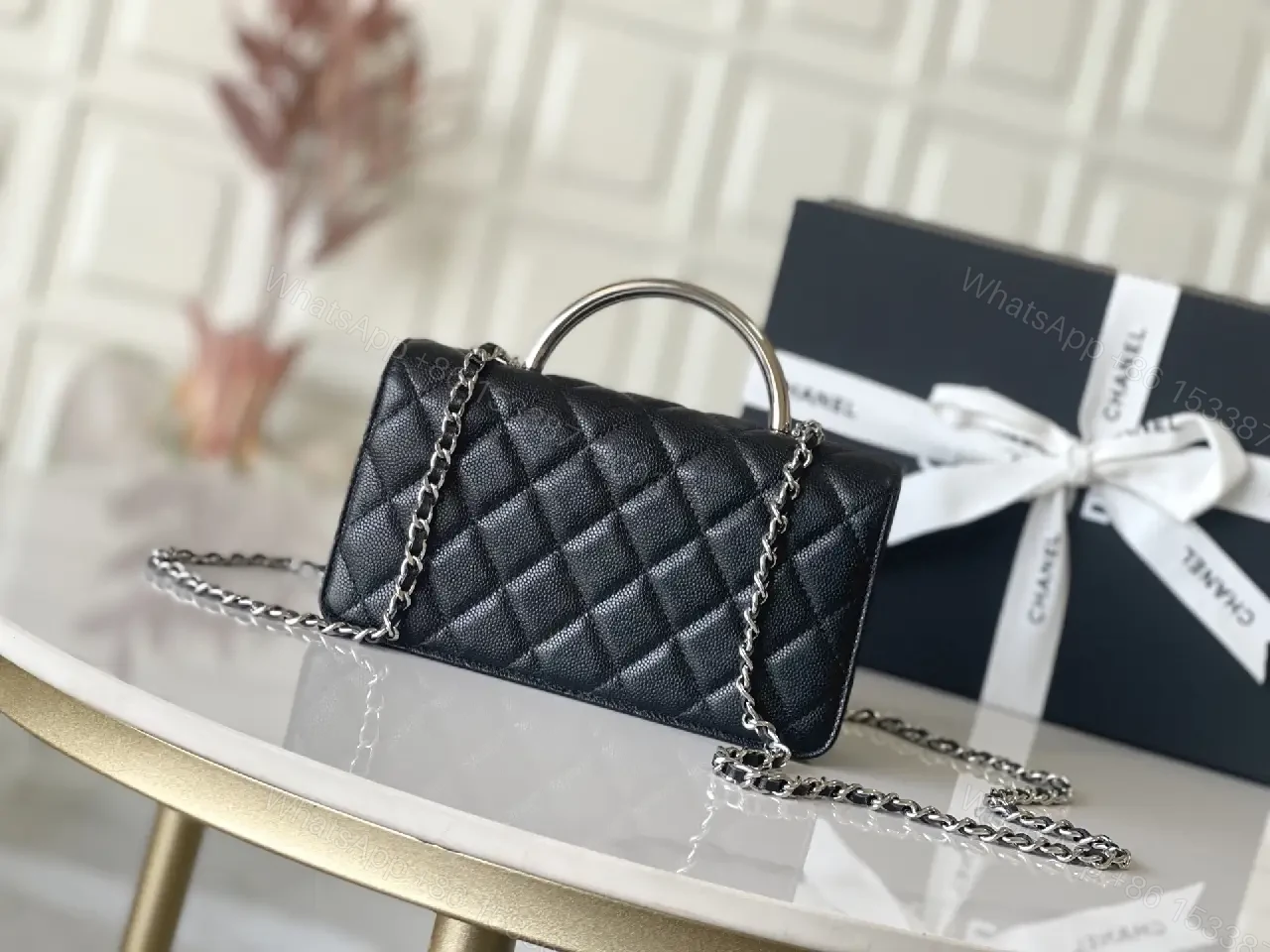 View 3 of Black Quilted Leather Mini Bag - Chain Handle, Compact Luxury