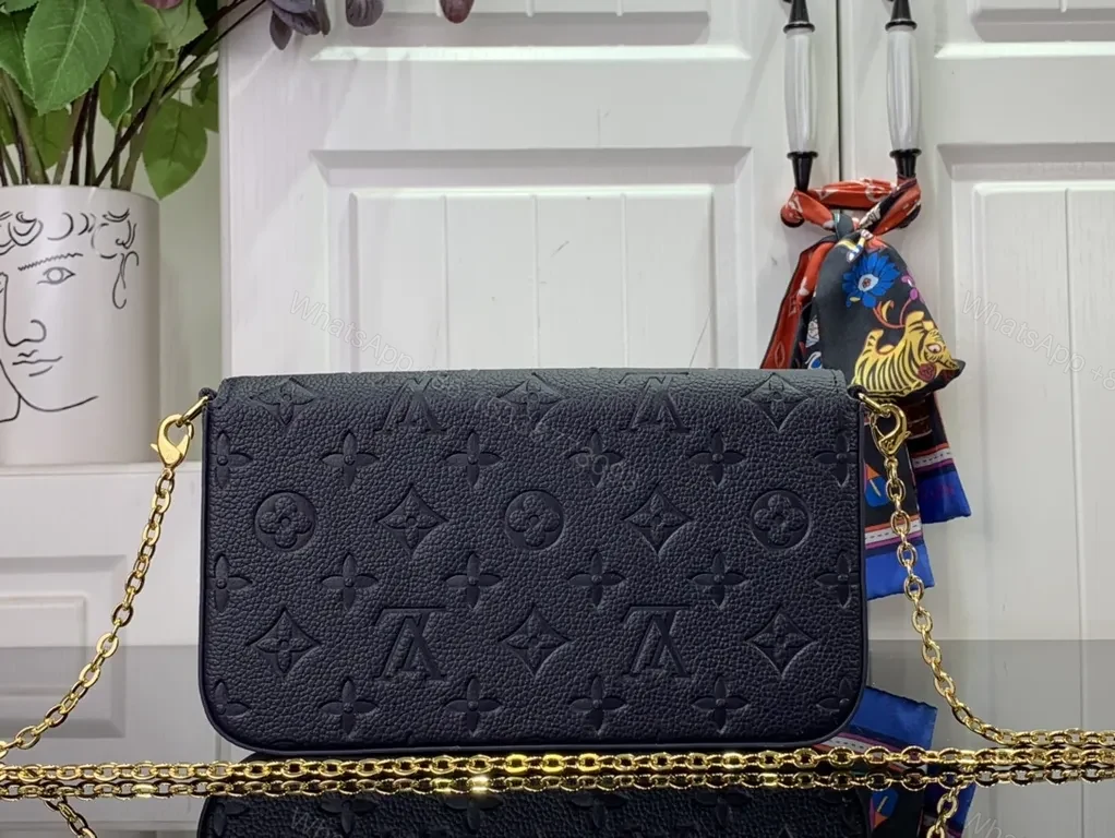 View 2 of Chic Leather Crossbody: Monogram Texture, Gold Hardware, Compact Envelope