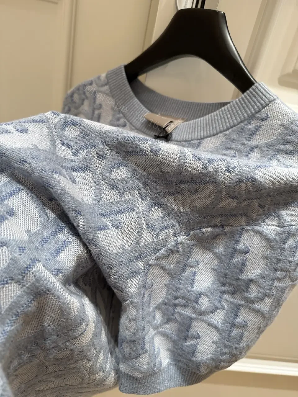 View 2 of Blue Denim Knit Pullover Dior Style Key Feature: Embroidered Pattern Sweater Dress