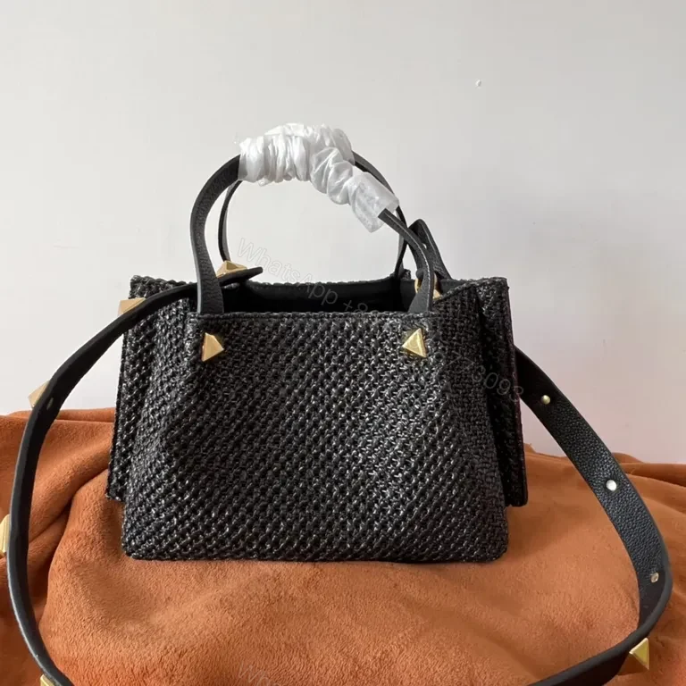 View 2 of Black Woven Luxe Handbag: Compact, Gold-Accent Style Bag