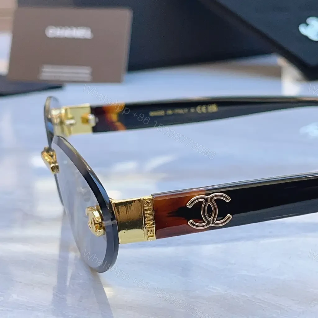 View 5 of Luxurious Silver-Gray Sunglasses: Gold Accents, Semi-Rimless Oval, Chanel Hardware