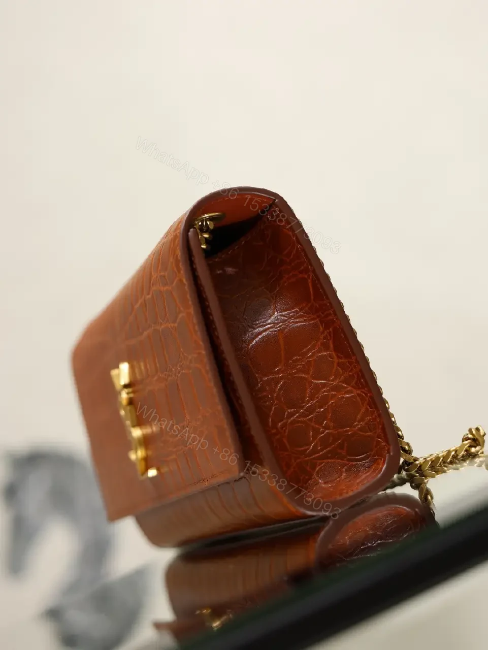 View 2 of Brown Crocodile-Embossed Leather Clutch with Gold Logo Clasp