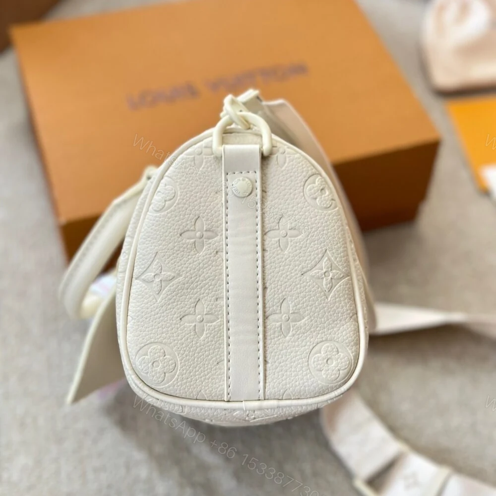 View 4 of Louis Vuitton Keepall Bandoulière Full Moon 25Cm M24434