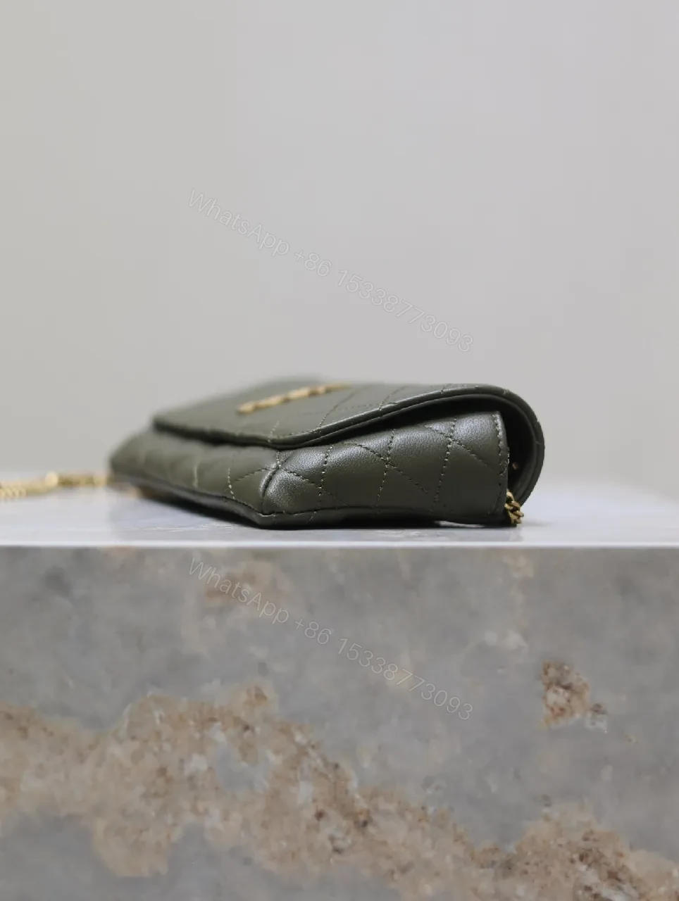 View 4 of Soft-Quilted Leather Clutch with Gold Emblem, Evening Style, Compact Luxury