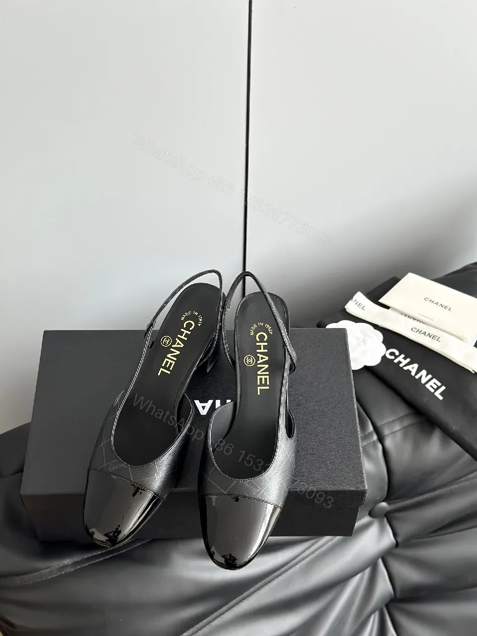 Black Leather Slingback Pumps with Quilted Detail — view 1