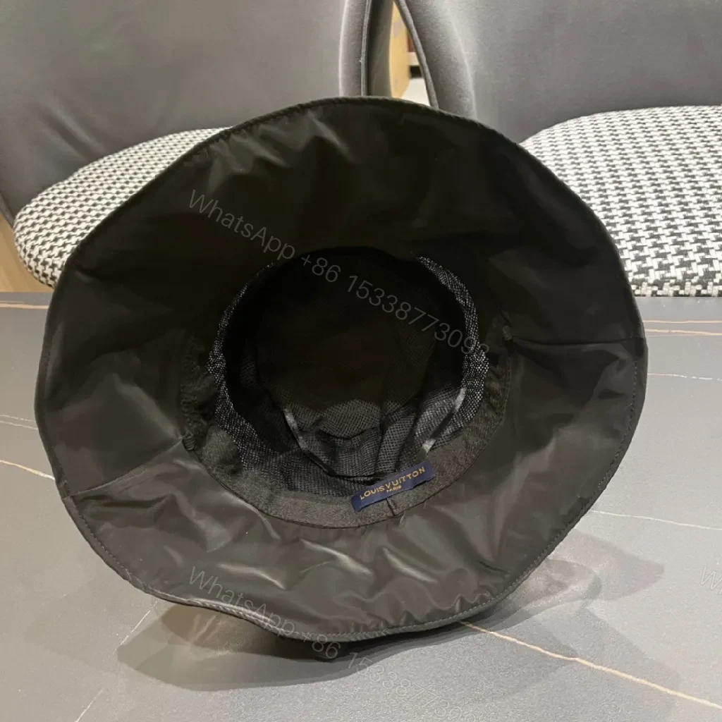 View 4 of Minimalist Black Bucket Hat with Discreet Luxe Label