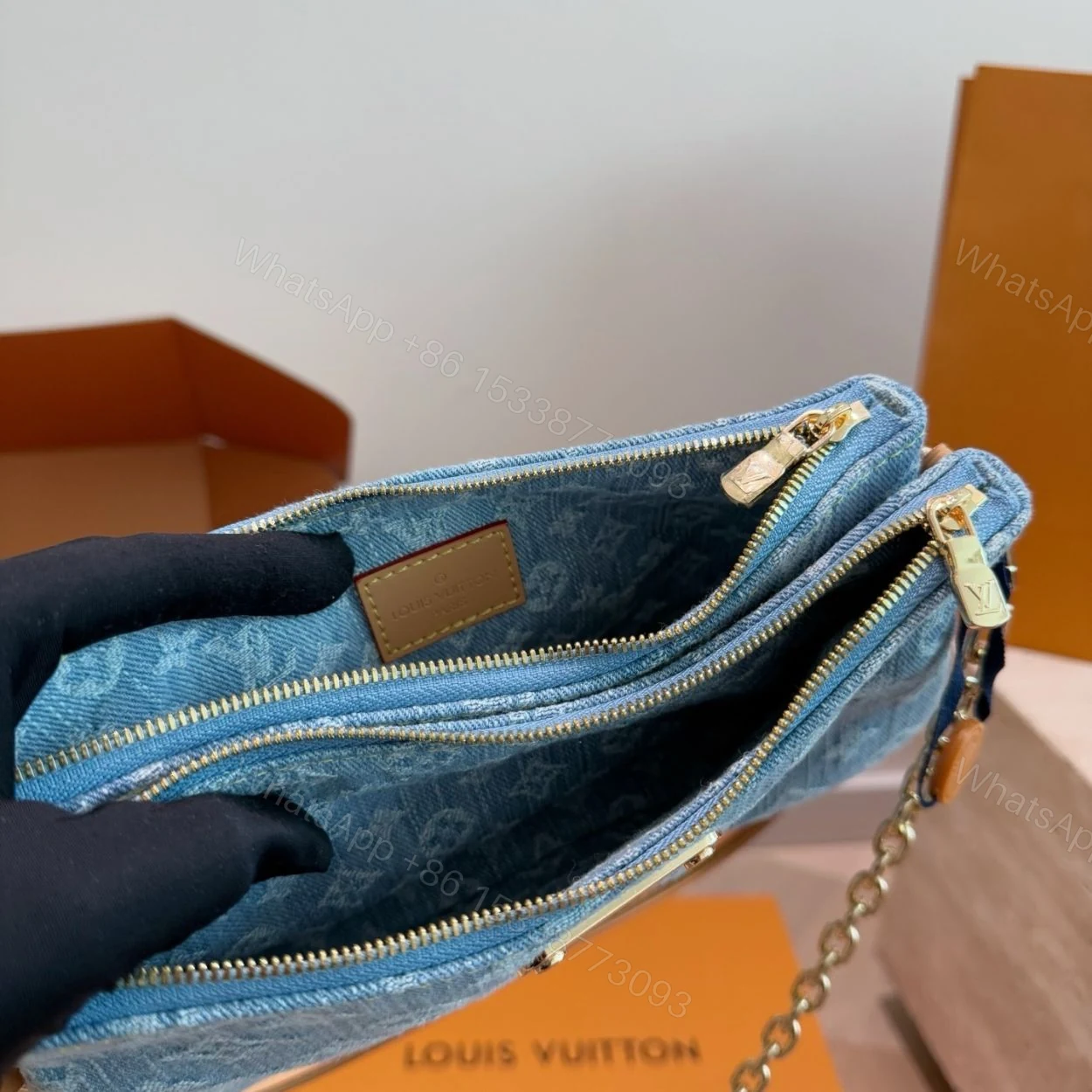View 8 of Louis Vuitton Liv Pochette Blue Denim 25Cm M83532