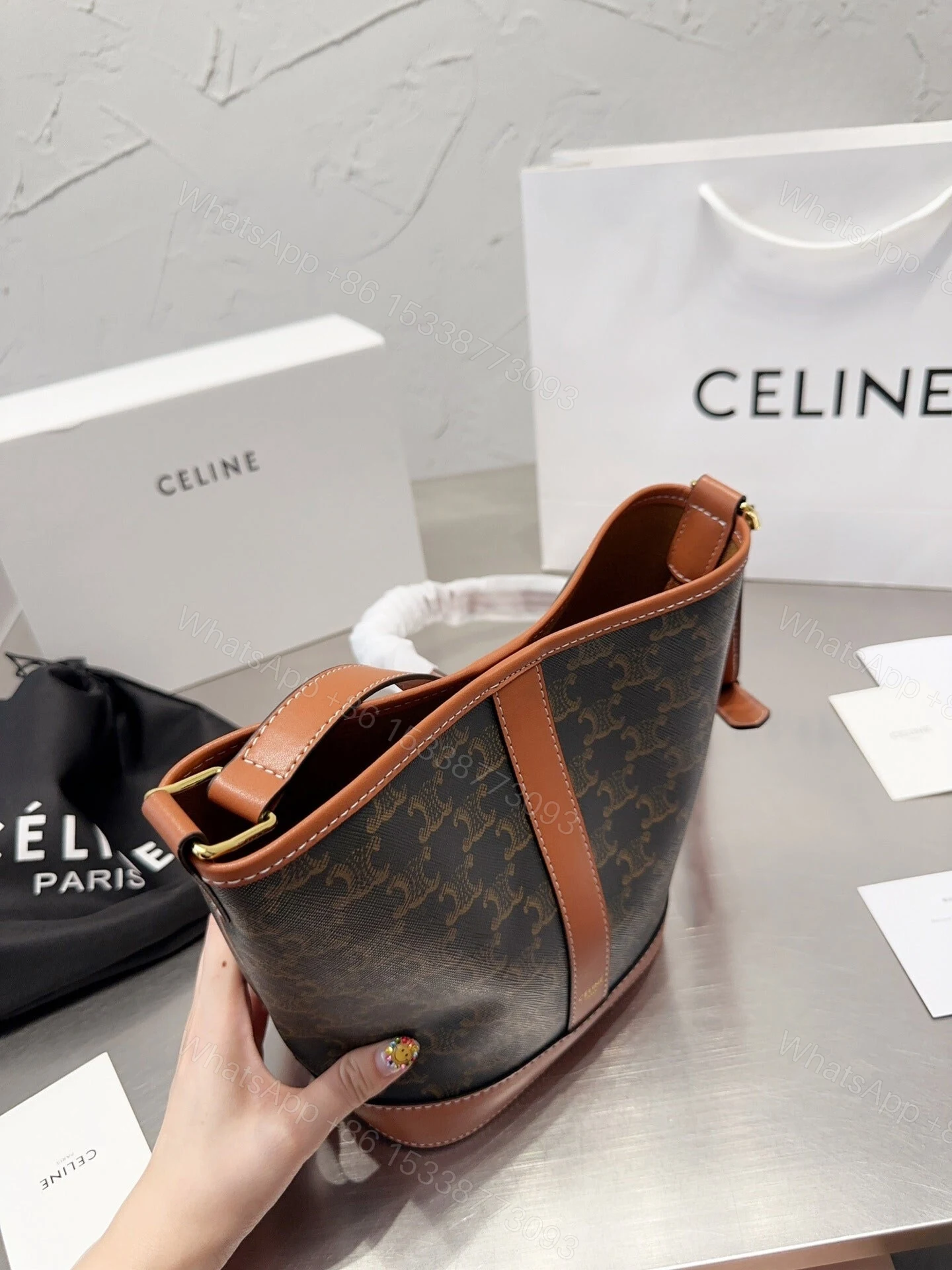 View 5 of CELINE SMALL BUCKET IN TRIOMPHE CANVAS AND CALFSKIN TAN 20CM 191442CAS04LU