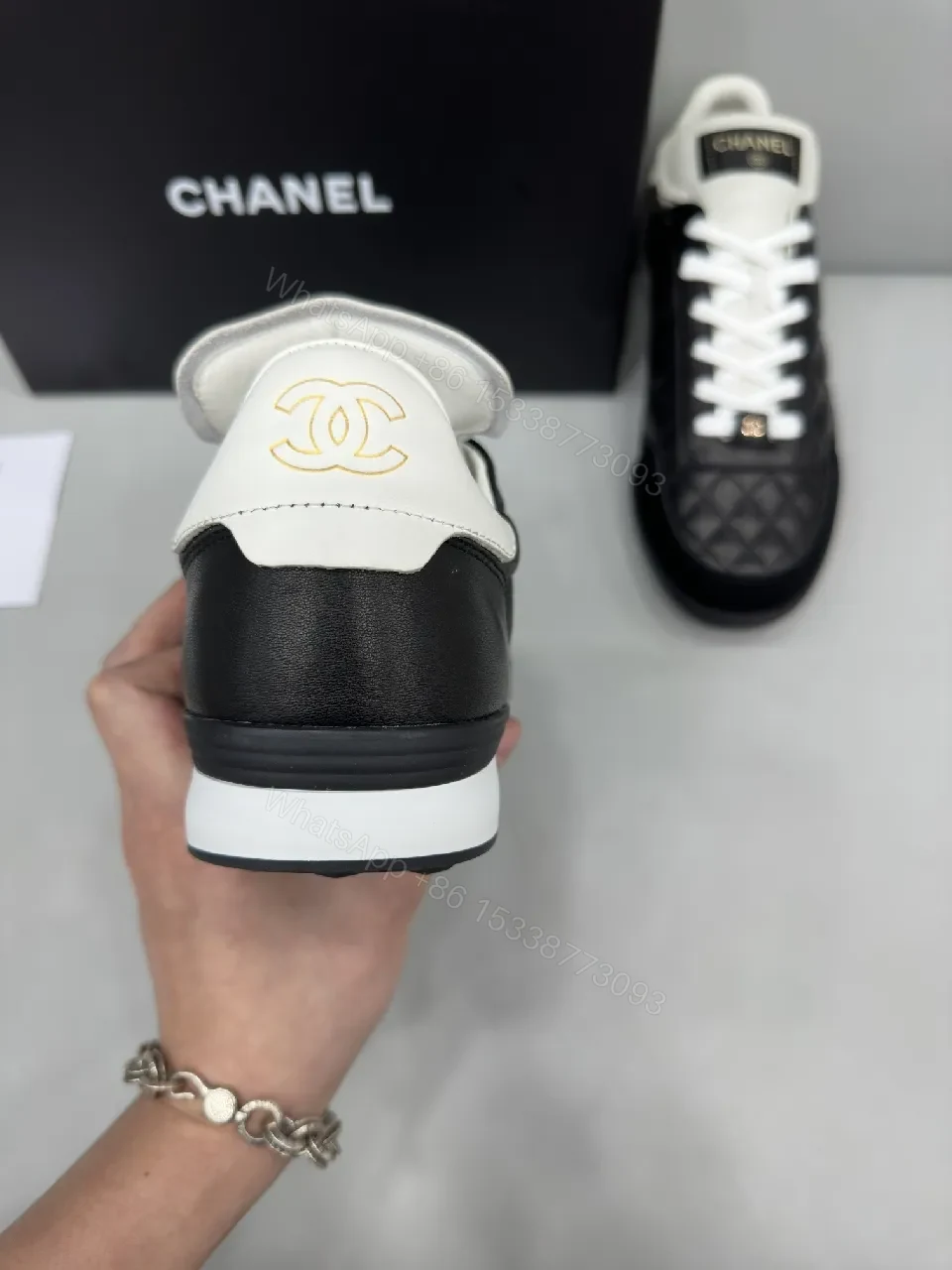 View 5 of Black-and-White Quilted Leather Sneakers with Luxe Hardware