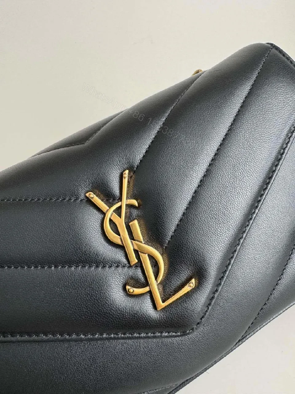 View 5 of Quilted Leather Crossbody Bag with Gold Emblem, Luxury Style
