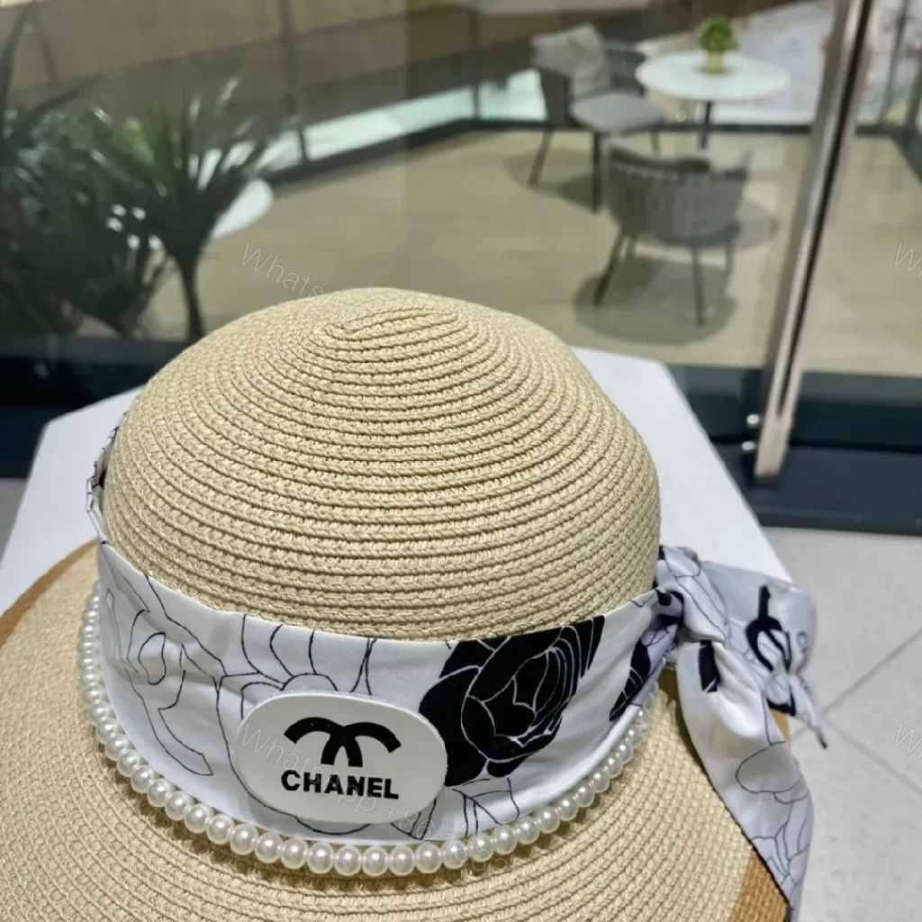 View 2 of Chic Wide-Brim Straw Hat with Pearl Band Detail