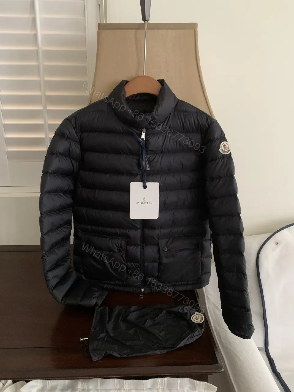 Black Nylon Puffer Jacket: Sleek, Insulated Warmth with Patch — view 1
