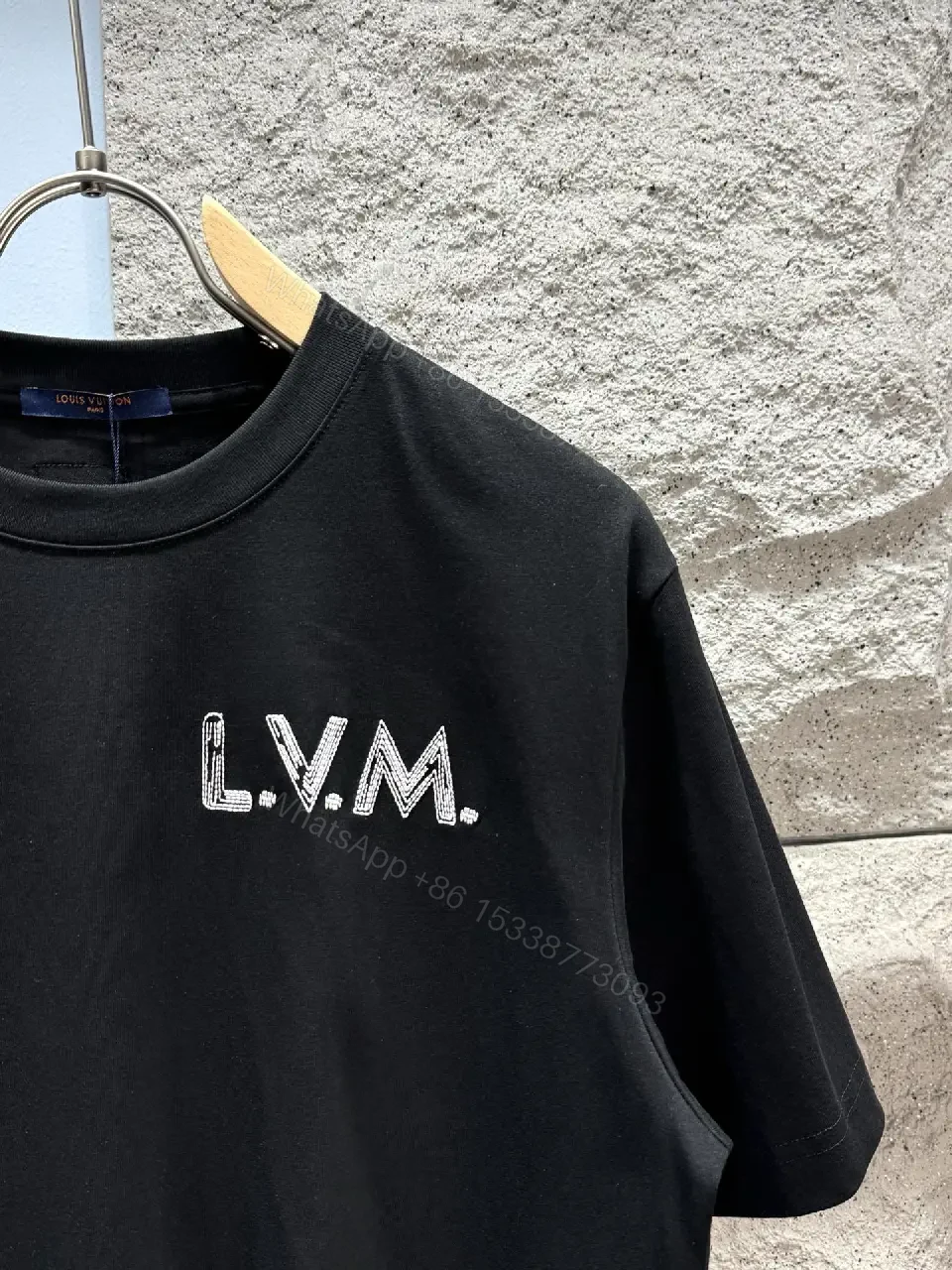 View 7 of Minimalist Black Cotton Tee with Subtle LV.M Logo