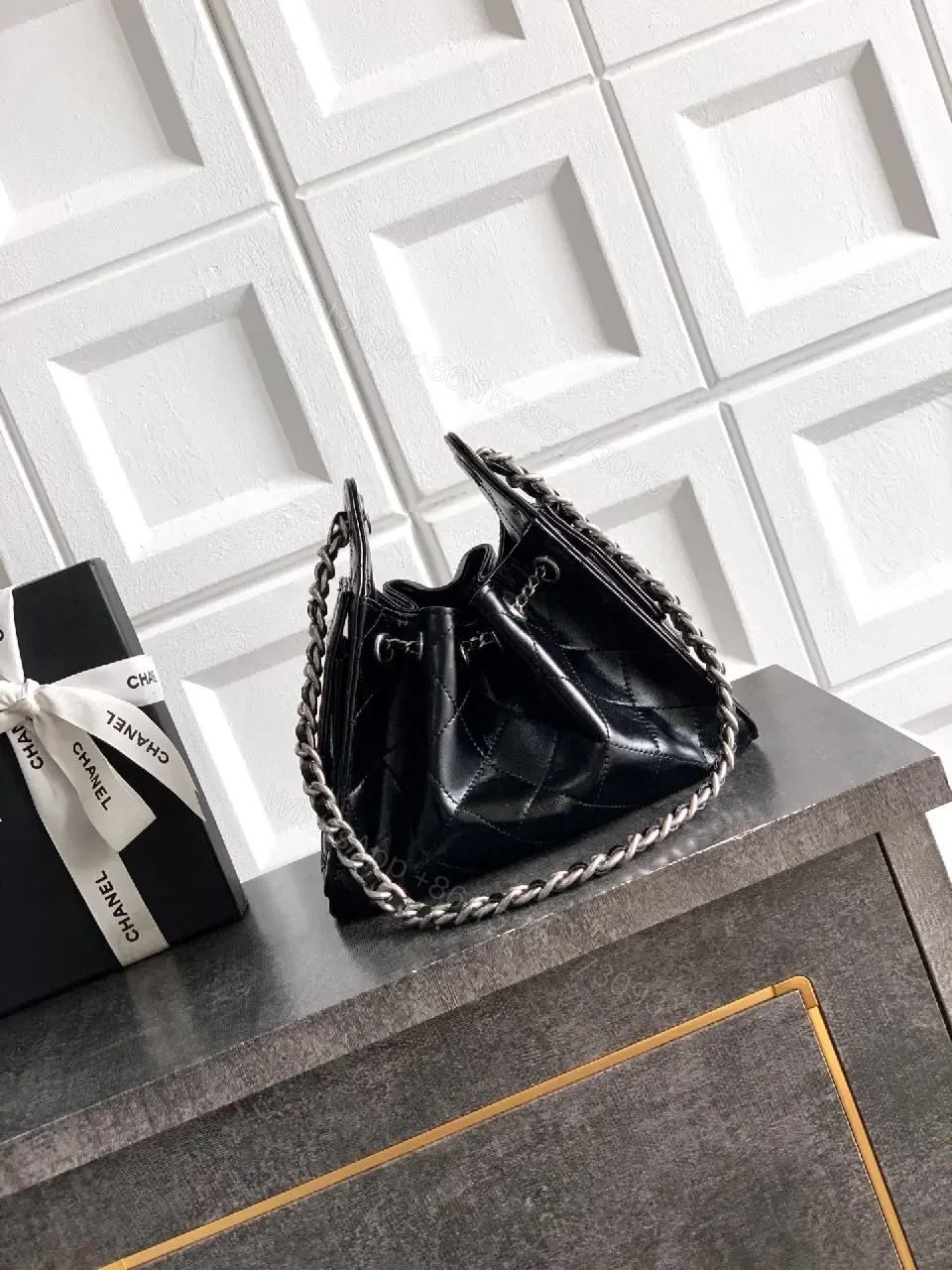 View 3 of Quilted Black Leather Bag with Chain Strap—Compact Elegance
